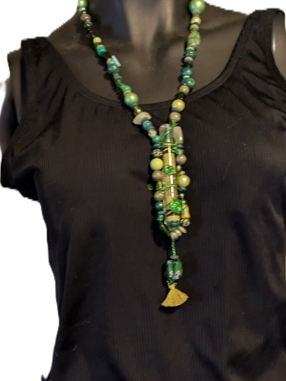 Made special for the season, this handmade necklace features an acrylic pendant